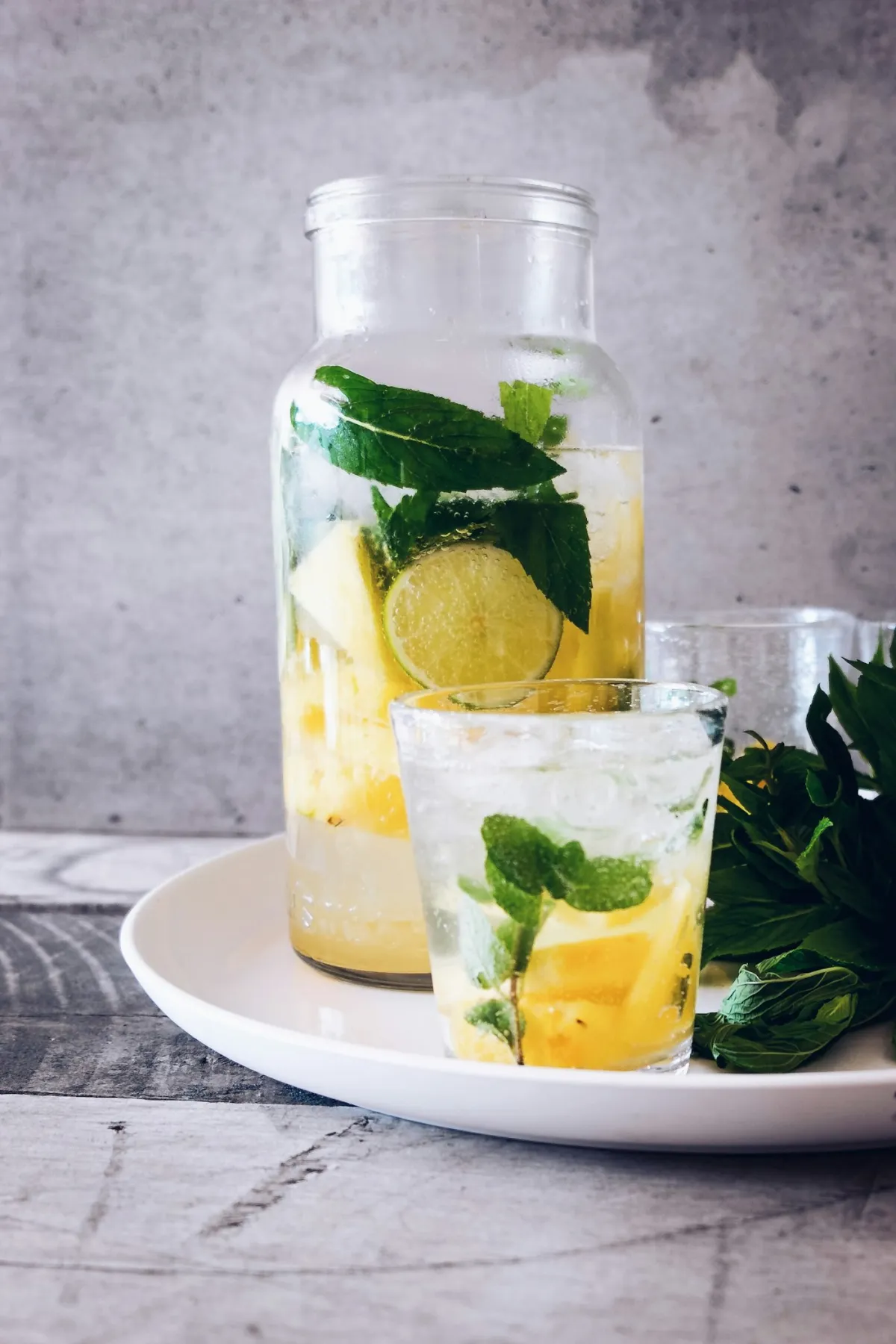 A glass of soda garnished with fresh mint